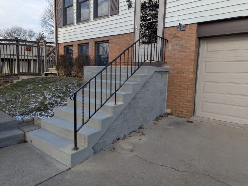 Ornamental handrail installed at a residence.