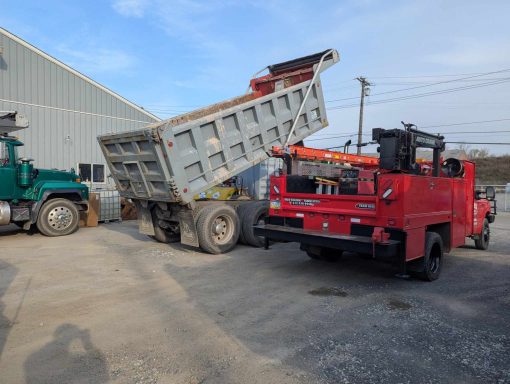 Tailgate repair on a tri-axle dump